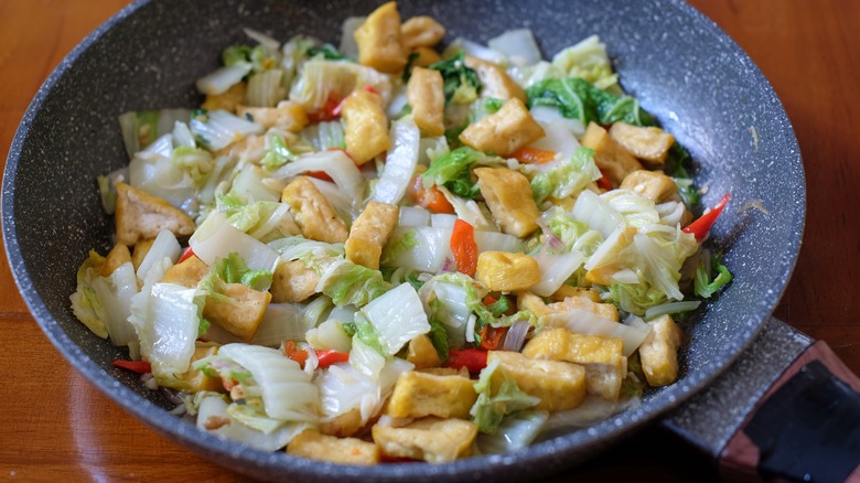 Cabbage and tofu stir fry in pan