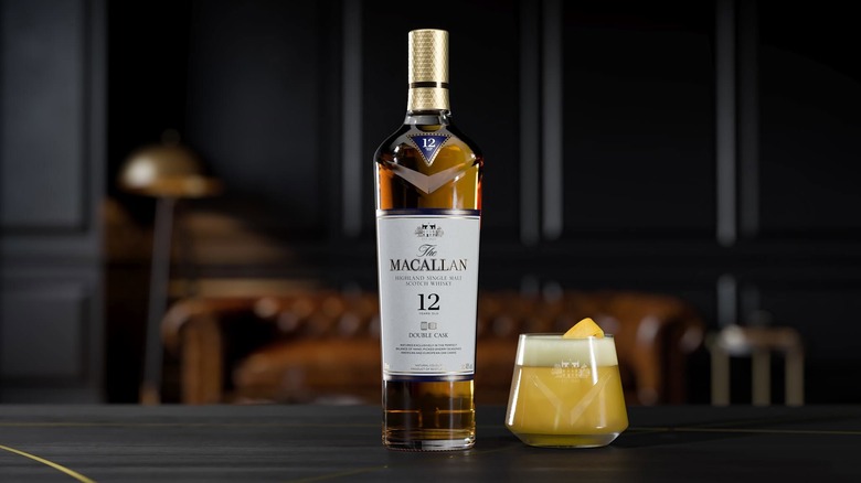 A bottle of The Macallan 12-year Double Cask placed on a table next to cocktail