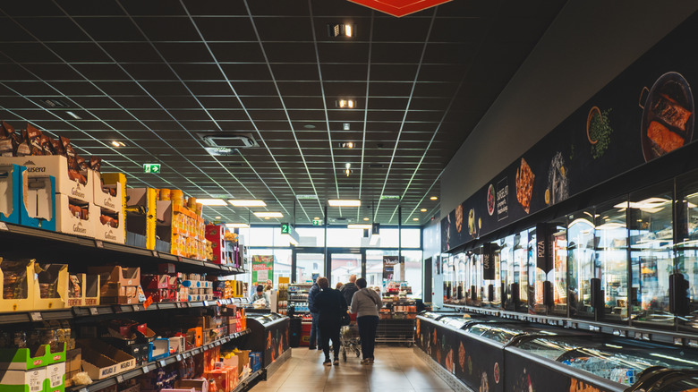 People shopping inside of an Aldi store