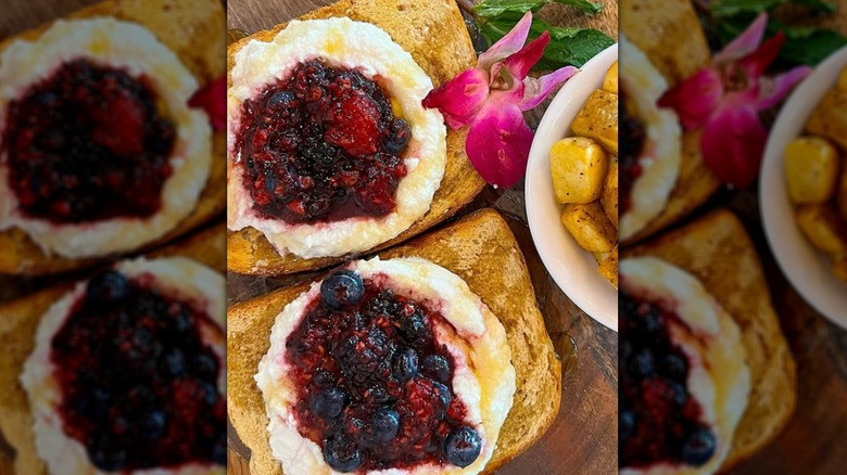 Smashed mixed berries on toast with ricotta cheese