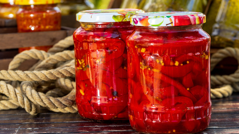 Jars of peppers soaking in vinegar