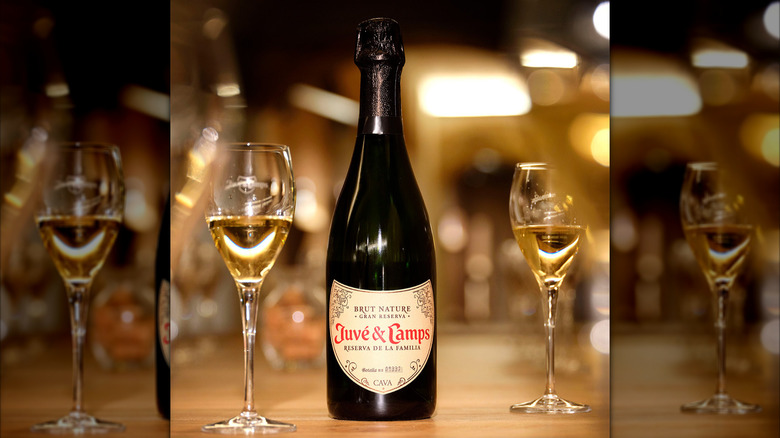 bottle of cava with two flute glasses