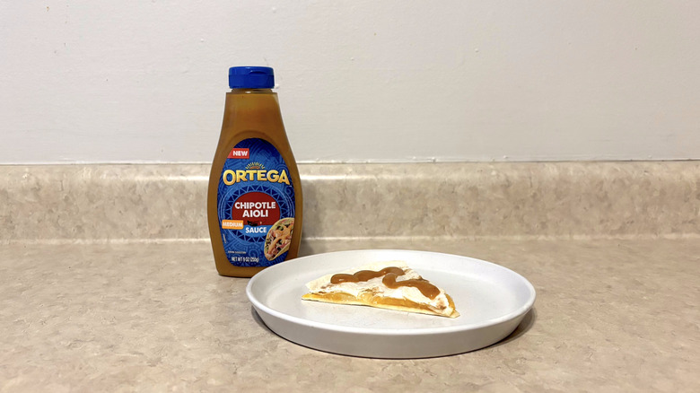 Ortega chipotle aioli sauce on quesadilla on white plate on countertop