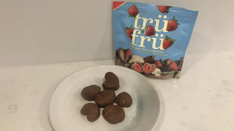 Tru Fru Strawberries in White & Milk Chocolate on a plate.