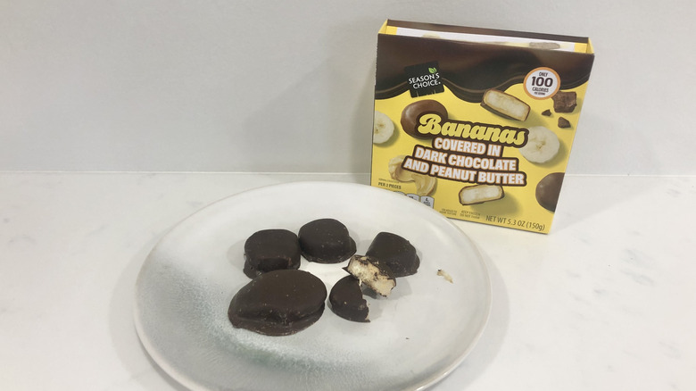 Aldi Season's Choice Bananas Covered in Dark Chocolate and Peanut Butter on a plate.