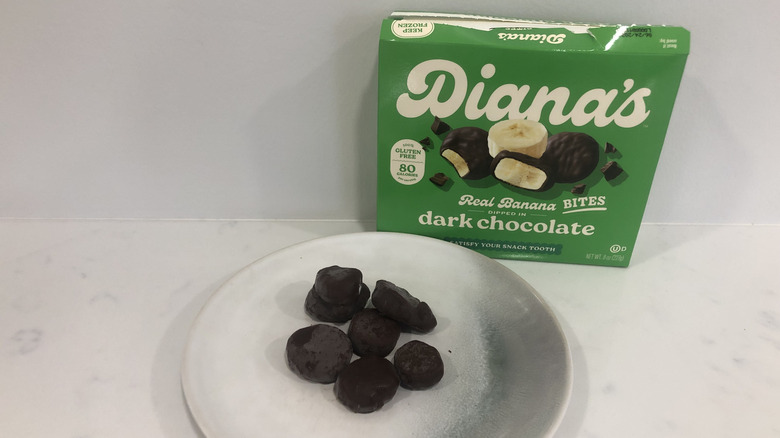 Diana's Frozen Banana Dipped in Dark Chocolate on a plate.