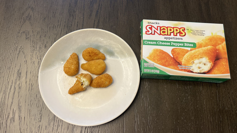 Snapps Frozen Cream Cheese Pepper Bites in a box and on a white plate