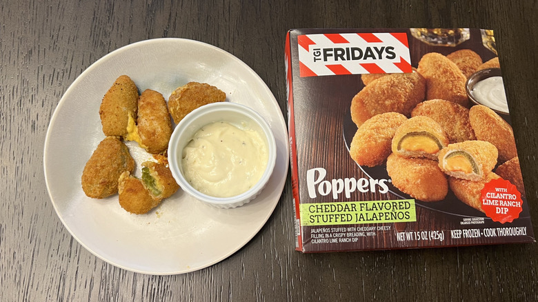 TGI Fridays Cheddar Cheese Stuffed Jalapeño Poppers in a box and on a white plate with a side of ranch dipping sauce