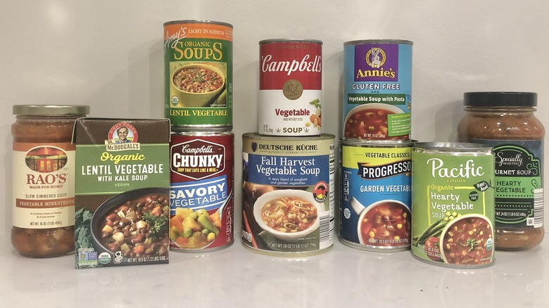 10 different store-bought vegetable soups stacked up.