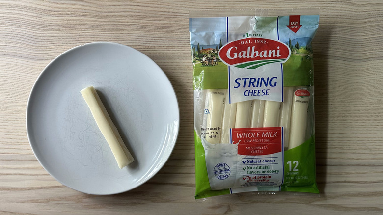 Galbani string cheese on wooden table