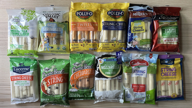 Packages of string cheese on wooden table