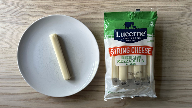 Lucerne string cheese on wooden table