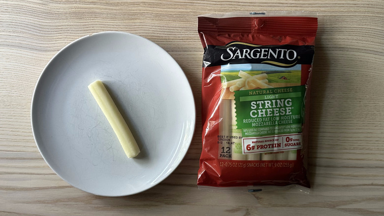 Sargento string cheese on wooden table