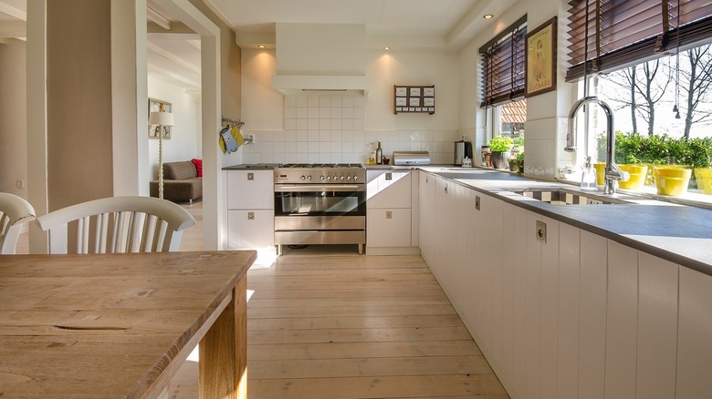 An airy kitchen with light gray soapstone counters