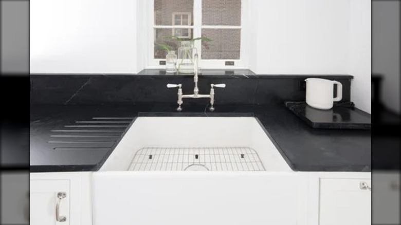Alexandria soapstone around a white sink