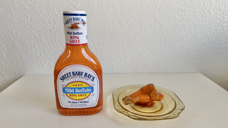 Mild Buffalo Wing Sauce bottle with chicken drum