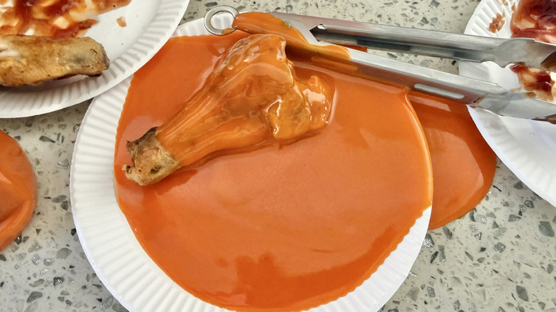 Spilled Buffalo sauces on plates