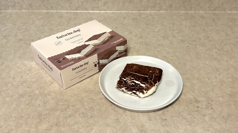 Favorite Day tiramisu on white plate and box on neutral background