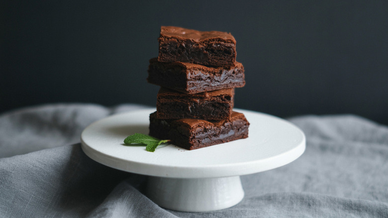 Stack of brownies on cake stand