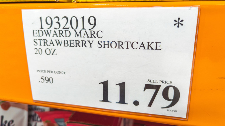 Costco price tag for strawberry short cake with asterisk in corner