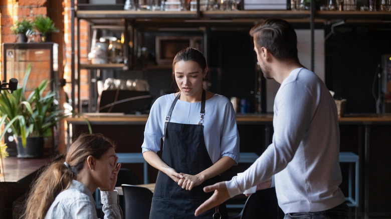 Unhappy woman at a restaurant