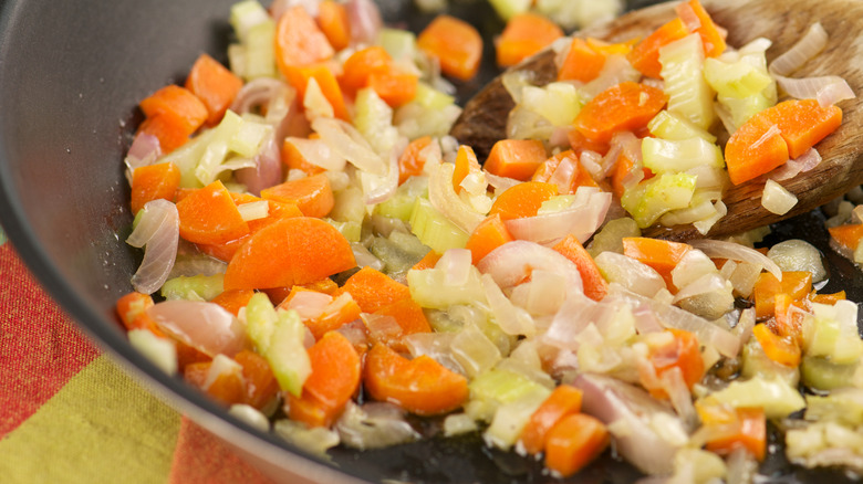Close-up of sauteeing mirepoix.