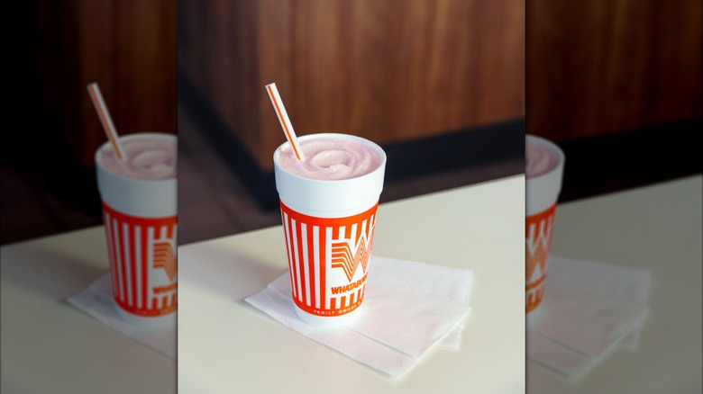 Whataburger shake with straw.
