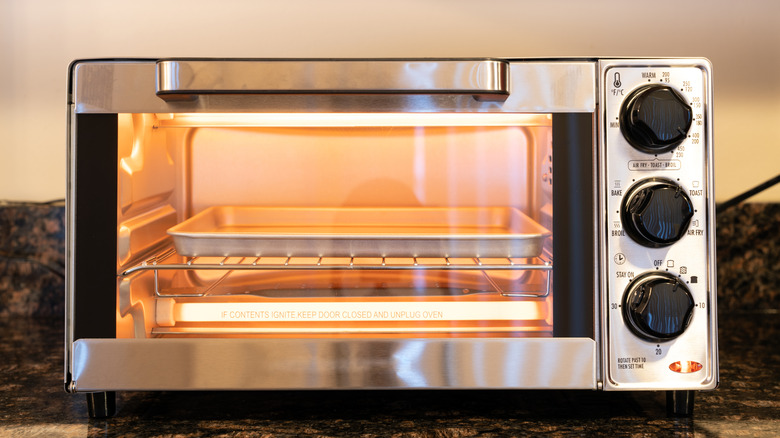 Stainless steel toaster oven with light on inside