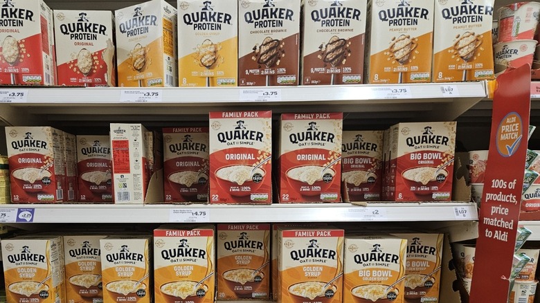 Boxes of Quaker Oats in a supermarket shelf