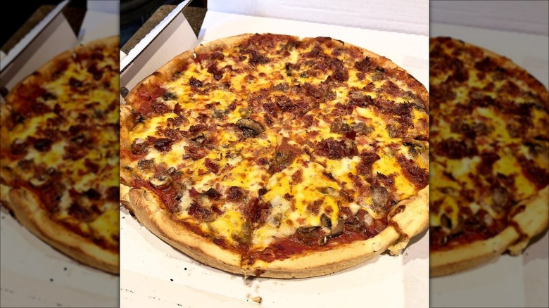 Mirrored image of takeaway pizza in box