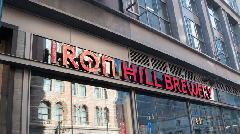 the front entrance and sign for the Iron Hill Brewery located on Market Street in Center City, Philadelphia