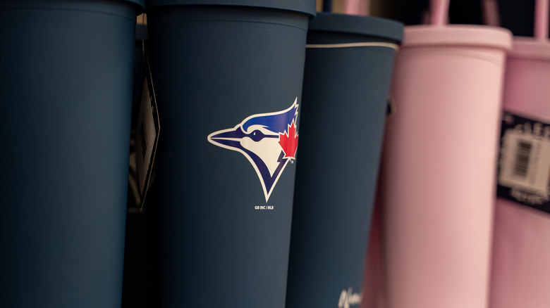 A row of tumblers with a sports logo design