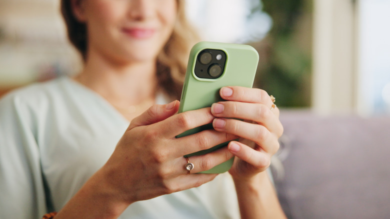 A woman scrolling through on her phone