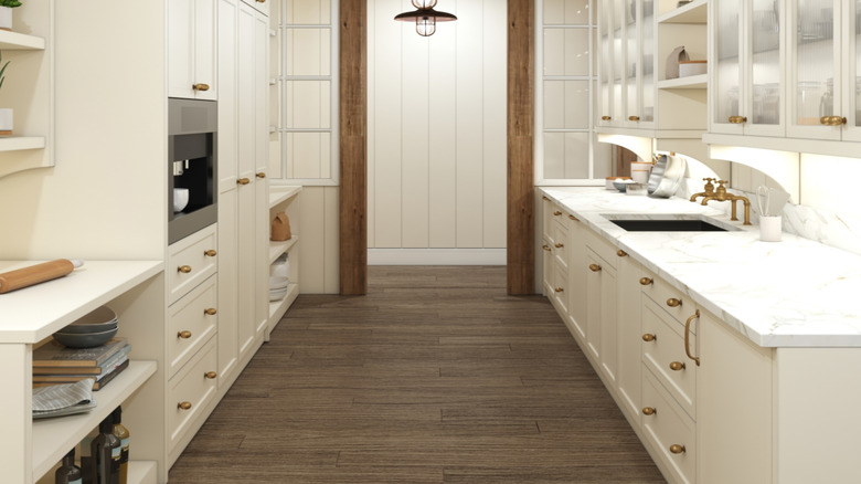 White walk-in pantry with three overhead pendant lights