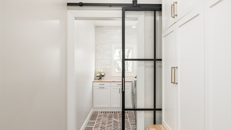 Sliding glass door partitioning the kitchen