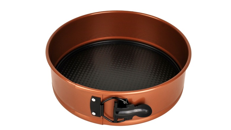 Isolated copper springform pan against a white background