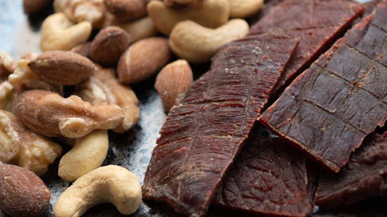 Close-up of beef jerky and mixed nuts