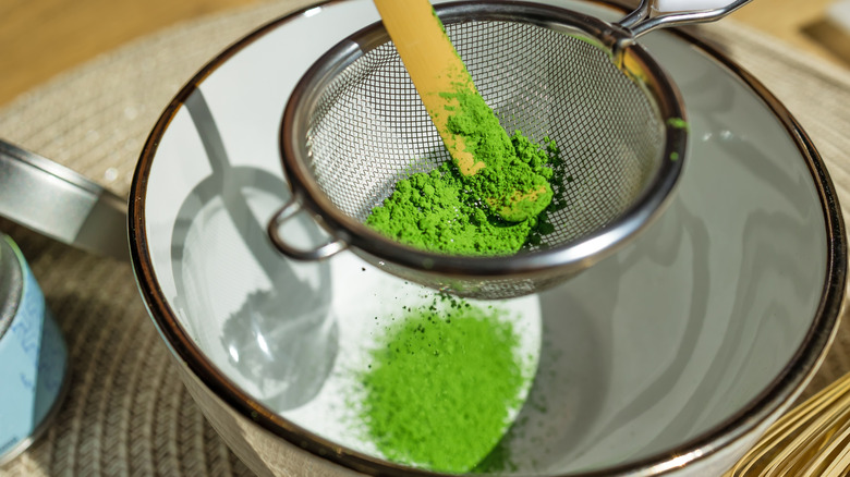 Matcha sifter over bowl with matcha