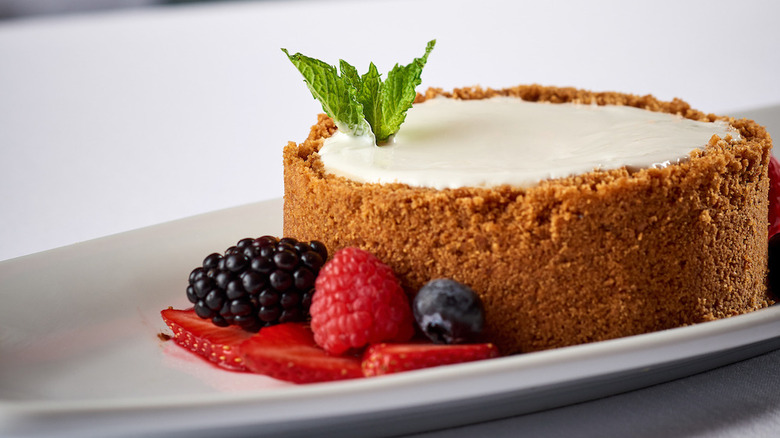 Cheesecake with berries on white plate at Ruth's Chris Steakhouse