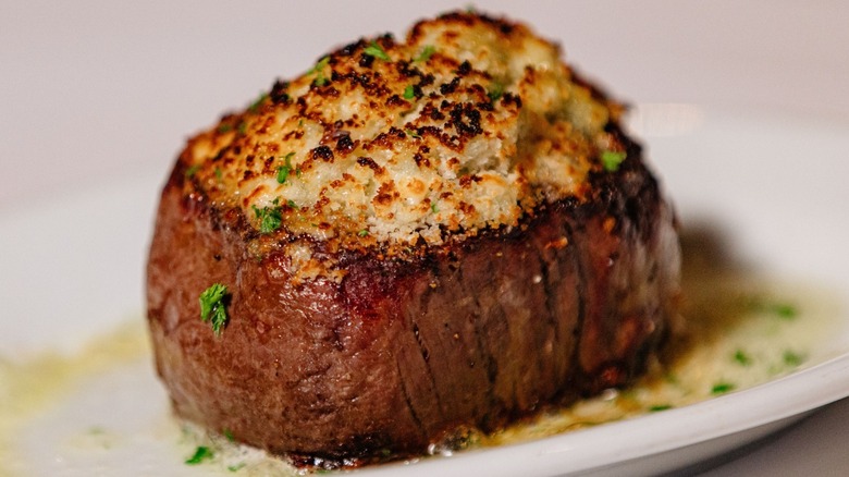 Truffle crust filet on white plate