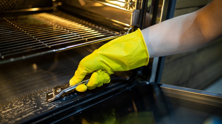 Person deep cleaning their oven