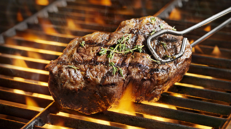 A sirloin steak grilling