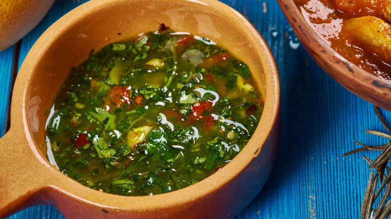 A dipping bowl filled with chermoula