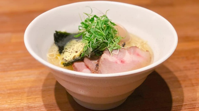 Shio butter clam in white bowl on wooden table