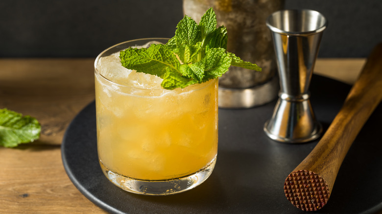 Whiskey smash on black tray