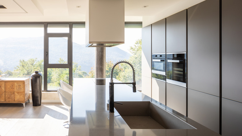Detail shot of a flushmount sink in a modern kitchen overlooking the hills