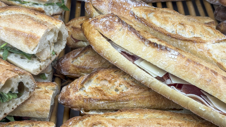 Pile of French baguette sandwiches with various fillings