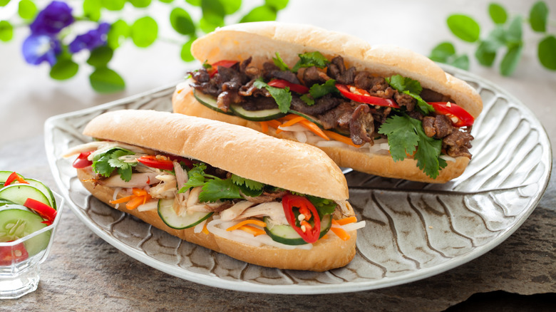 Vietnamese banh mi sandwiches with various colorful fillings served on a plate
