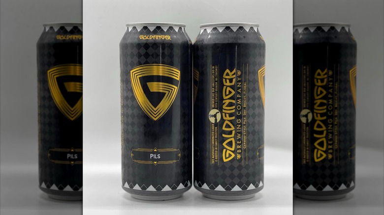 Two cans of Goldfinger Pils