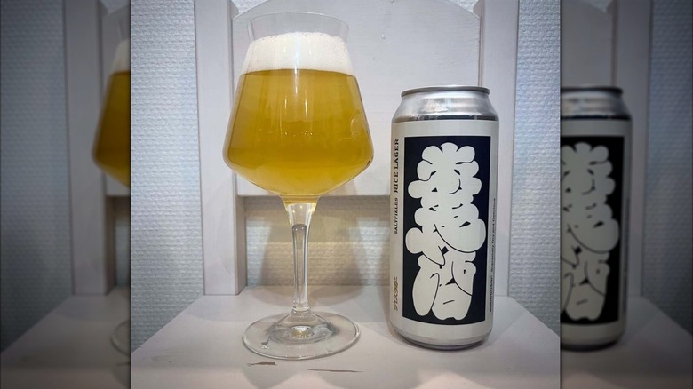 A glass of Nodogoshi next to its can